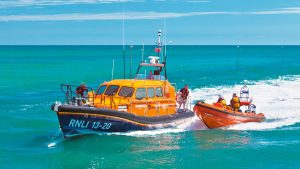 Two RNLI lifeboats side by side at sea