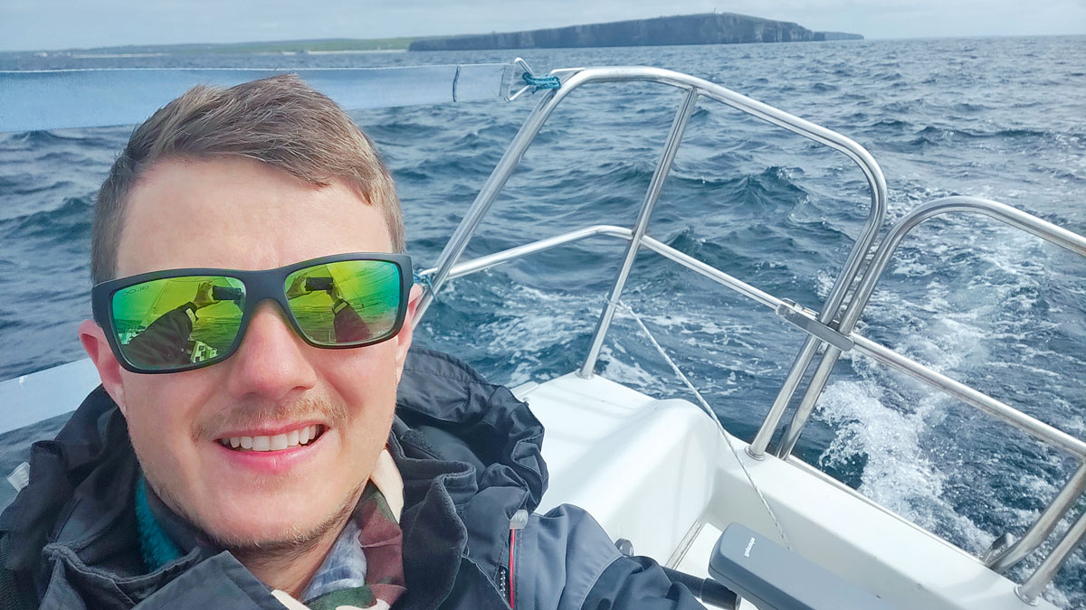 A man on a yacht during a solo sail around Britain