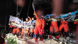The crew of Pen Duick VI celebrating