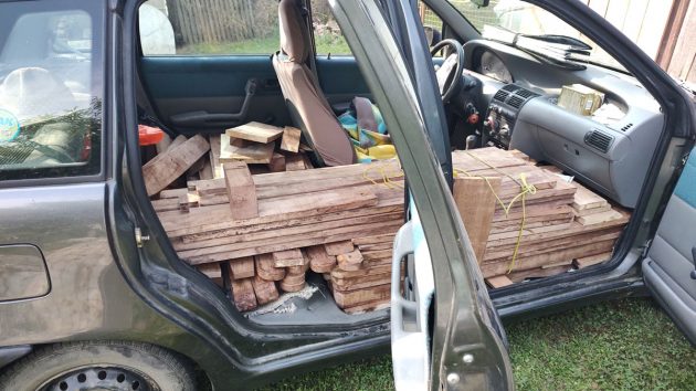 Boats stands loaded into the back of a car