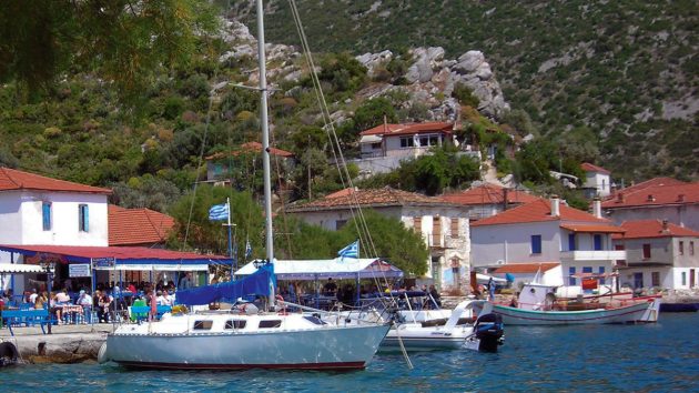 A boat anchored in a Greek town after Mediterranean sailing
