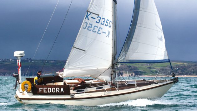 A Elizabethan 31 sailing yacht sailing under a dark sky