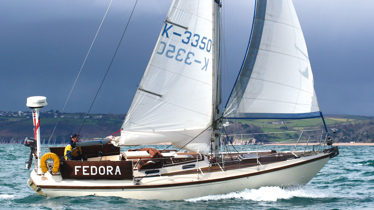 A Elizabethan 31 sailing yacht sailing under a dark sky