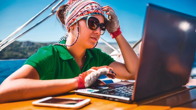 A woman working on a sailboat