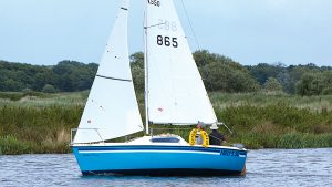 A boat performing a tack on a river