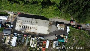Aerial image showing fire damage at Cockwells Modern & Classic Boatbuilding Ltd production facility at the former Vospers site near Falmouth