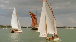 A still from the film Wind, Tide & Oar showing boats sailing