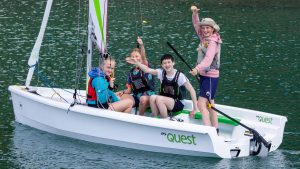children in a boat at a sailing club. Funding the Future competition aims to nurture sailing clubs