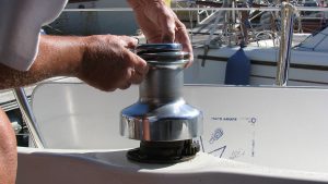 A man servicing a two-speed winch