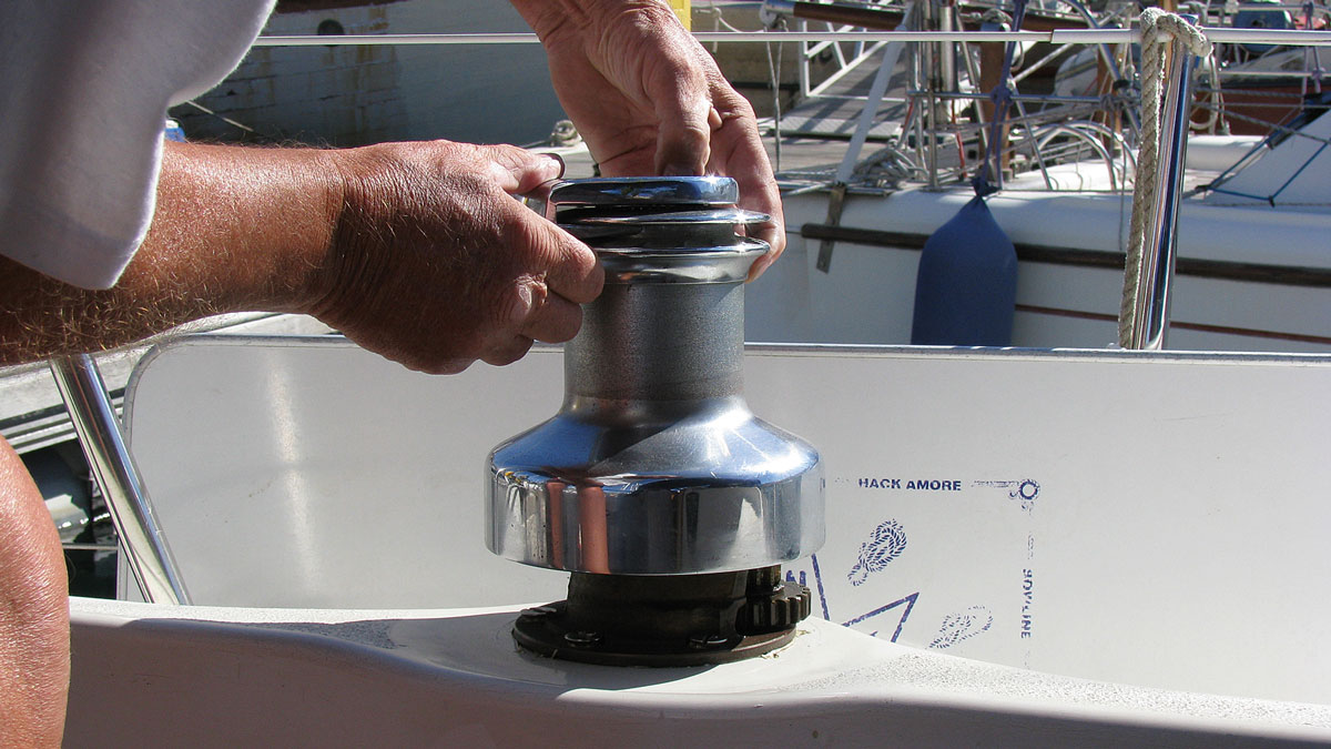 A man servicing a two-speed winch
