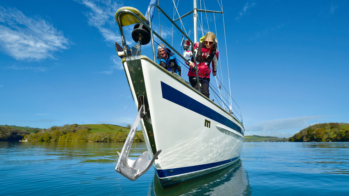 A woman preparing to set a boat anchor
