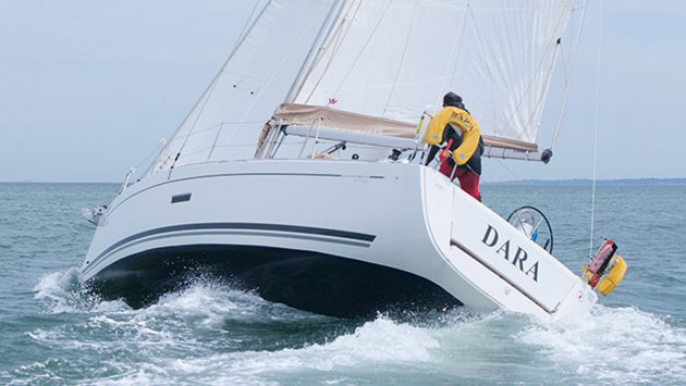 A boat broaching while sailing out to sea