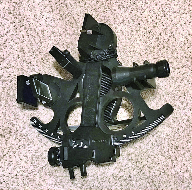 A sextant lying on the ground