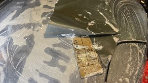 An outboard cowling being rubbed down