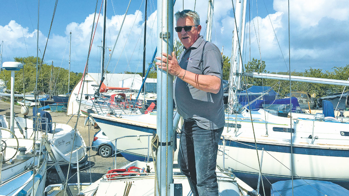 A man in a boat to carry out a yacht survey