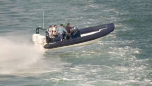 Rigid inflatable boat travelling at speed. Photo credit: Alvey & Towers Picture Library/Alamy