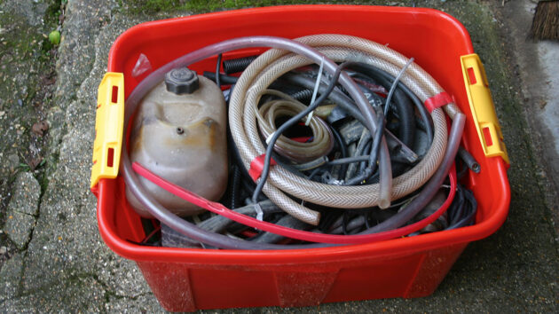 A red box filled with hoses