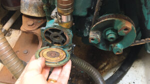 A man winterising a boat engine