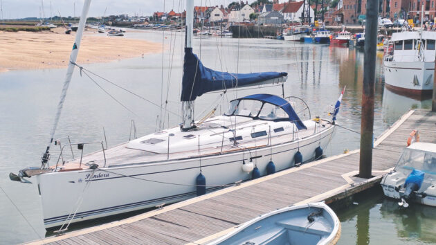 A boat moored next to a pontoon