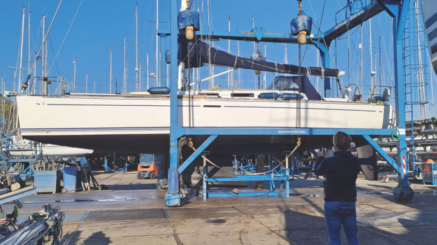 A boat in a cradle in a boatyard