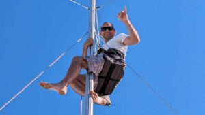 Sailor John Blenkinsop up a boat mast