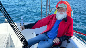 Mike Blenkinsop sitting at the helm of his boat