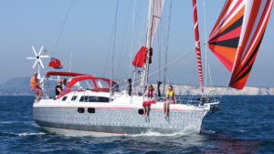 People on the deck of a Ovni 395 yacht
