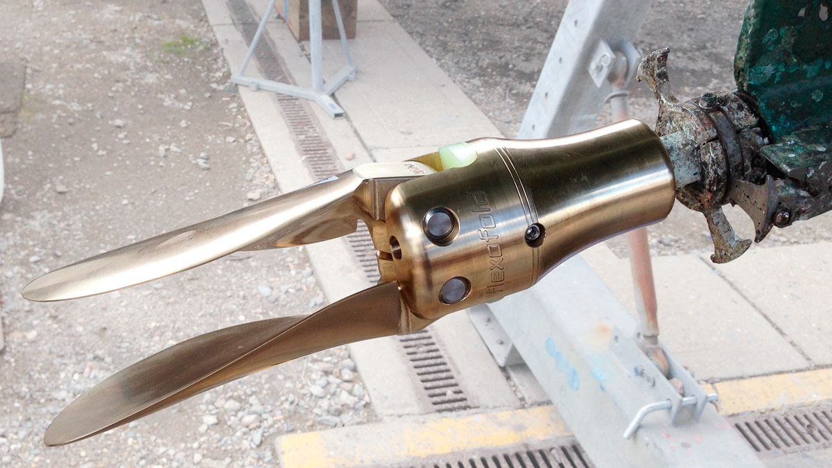 A folding propeller fitted on the stern of a boat
