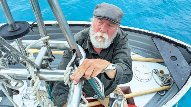 A Monitor wind vane self-steering system being installed on a boat