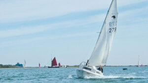 A SeaHawk 17 sailing along the coast