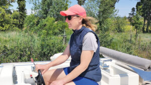 A woman wearing a blue Helly Hansen Crew Insulator 2.0 vest