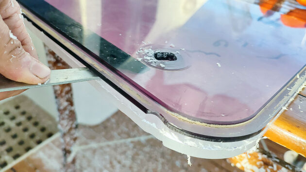 A boat hatch being replaced on a boat