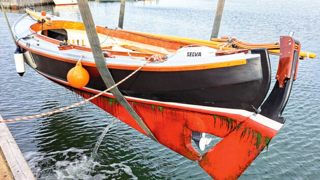 A boat being lifted out of the water