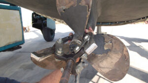 A three legged puller being used to remove a boat propeller to carry out a cutless bearing replacement