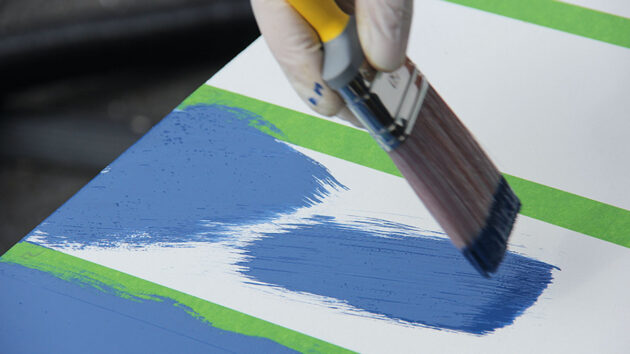 A person painting a boat