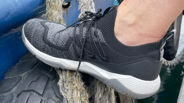 A woman wearing Xtratuf Kiata trainers