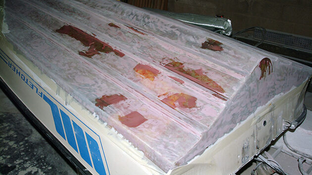 The surface was examined and areas requiring additional filling were faired again.