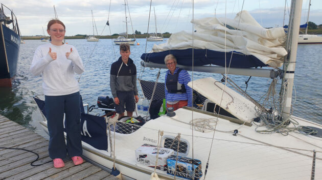 Teenage sailor Jack Gore - pictured centre - with his sister Rosie (left) and mum (right)on the Fambridge pontoon