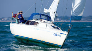 A couple sailing a Gib-Sea 242 yacht