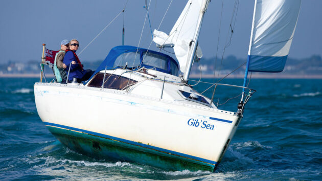 A couple sailing a Gib-Sea 242 yacht