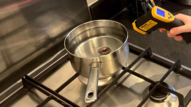 A pan of water being heated on a stove