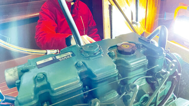 a heat exchanger installed on a boat after exhaust elbow repair
