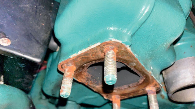 The flange of the exhaust elbow on a boat engine