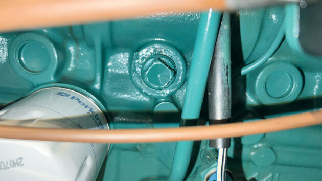 A coolant drain plug on a boat engine