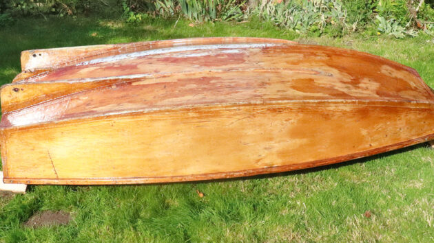 The upturned hull of a wooden boat