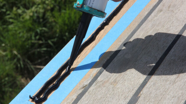 sealant being applied to the deck of a boat