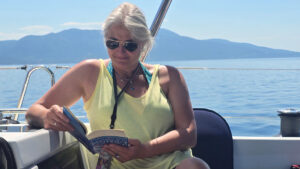 A woman reading on a boat