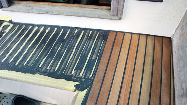 A teak deck being caulked