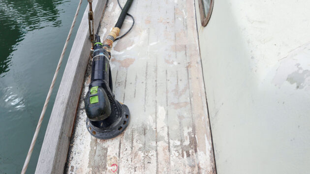 The deck of a boat being sanded in preparation for SoftSand coating