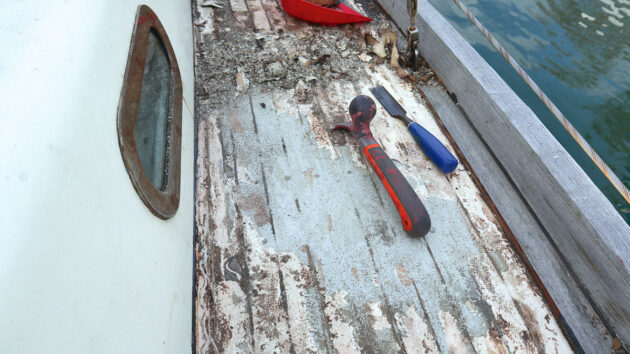 Deck on a boat being removed by tools